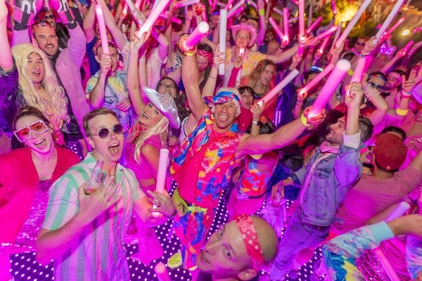 A group of people dancing with Baribie and Ken